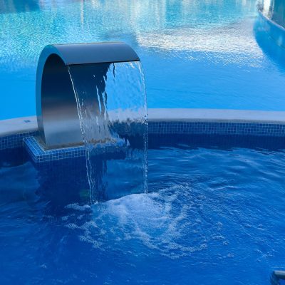 Empty,Swimming,Pool,With,Waterfall,Jet,,Jacuzzi,In,Action.spa,And